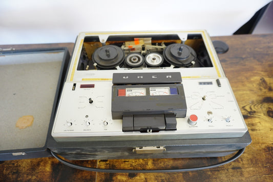 Vintage UHER reel-to-reel tape recorder in carrying case
